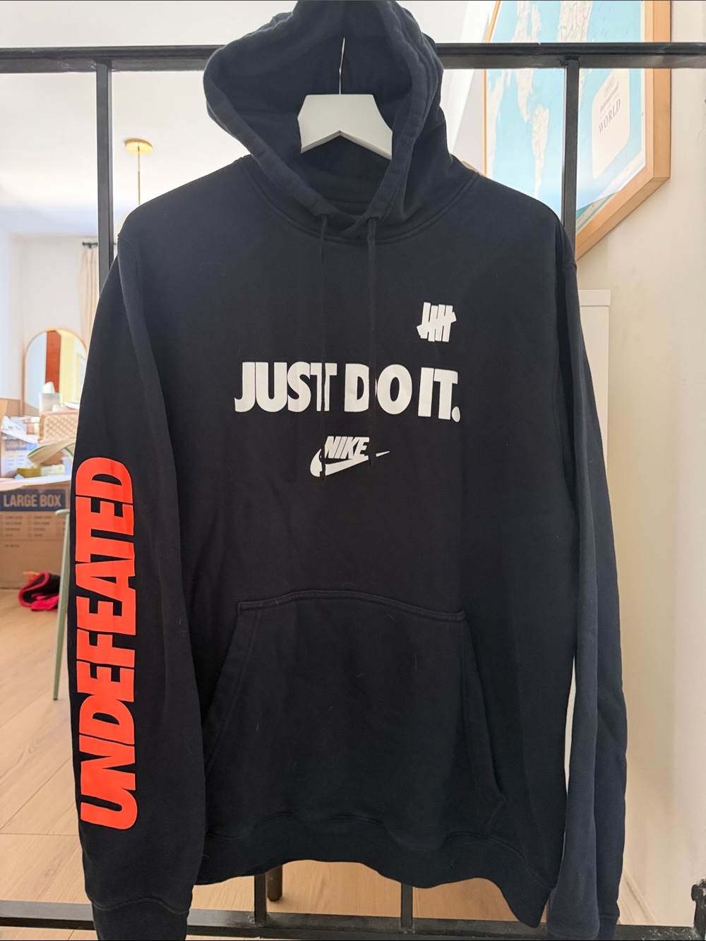 Undefeated Men's Black Zip-Up Style Hoodie with Red Sleeve Logo